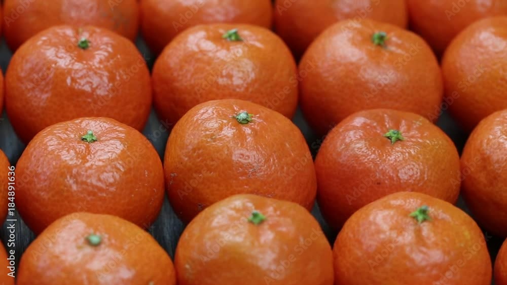 Fresh orange, tangerine fruit, mandarin pattern, high vitamin C good for health, rotates, close up Fresh orange, tangerine fruit, mandarin pattern, high vitamin C good for health, rotates, close up
