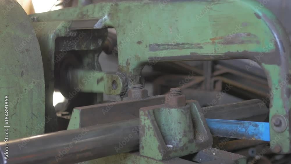 Machine cutting metal pipe down to correct size Machine cutting metal pipe down to correct size