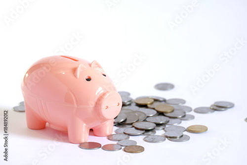 Pink Piggy bank with stacked coins