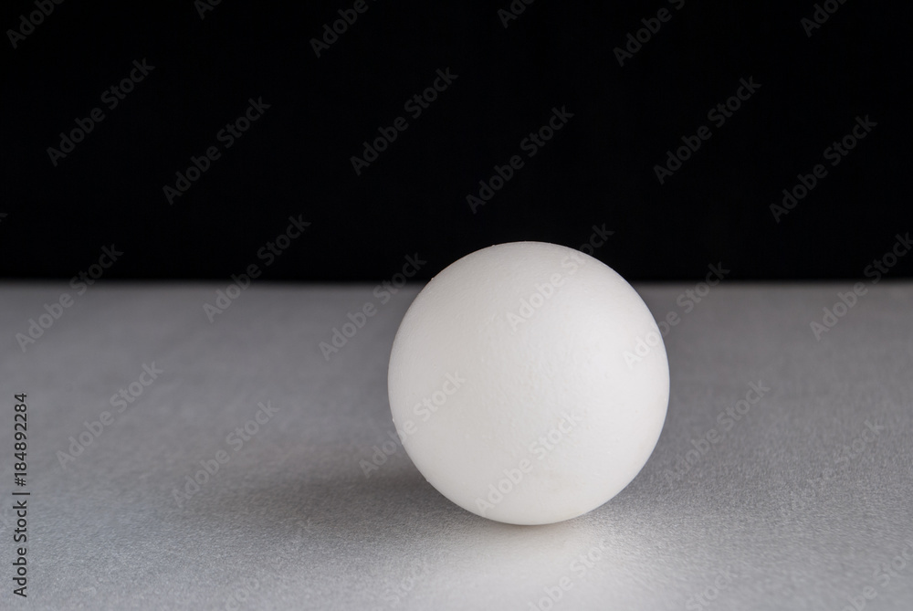 egg on a gray and black background egg on a gray and black background
