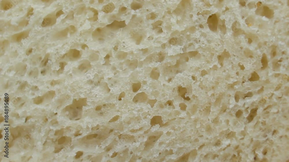 Texture of white bread rotating extreme close up, macro shot Texture of white bread rotating extreme close up, macro shot