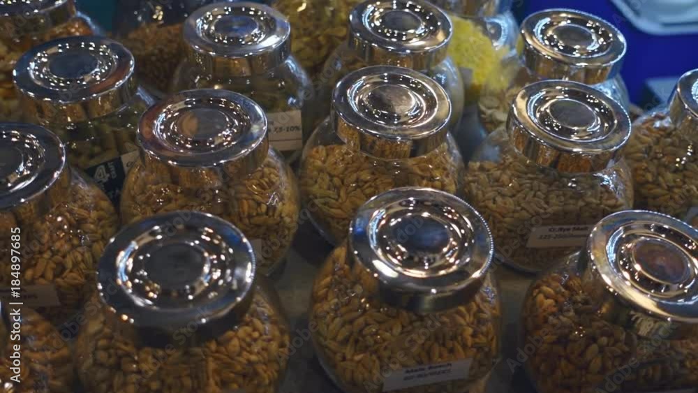 Different grains and other ingredients for making tasty beers are packaged in different glass jars with chrome lids. Shot in motion
Different grains and other ingredients for making tasty beers are packaged in different glass jars with chrome lids. Shot in motion