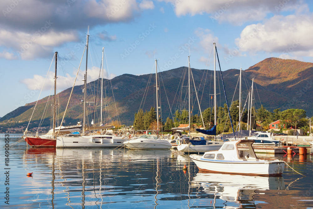 Yachts and fishing boats on the water near seaside village of Seljanovo. Bay of Kotor (Adriatic Sea), Tivat, Montenegro