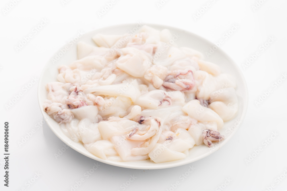 raw calamari on plate isolated on white raw calamari on plate isolated on white