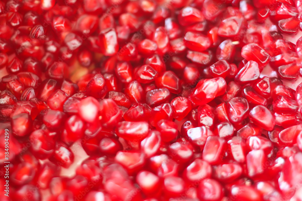 Red ripe pomegranate grains on white background. Red ripe pomegranate grains on white background.
