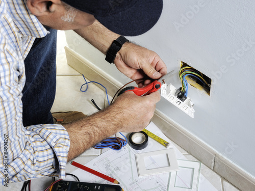 Electrician working in a residential electrical system