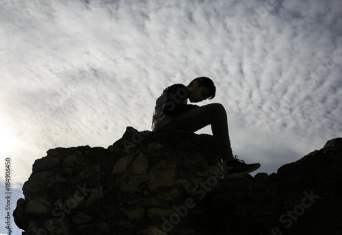 Shadow shape of a sited boy