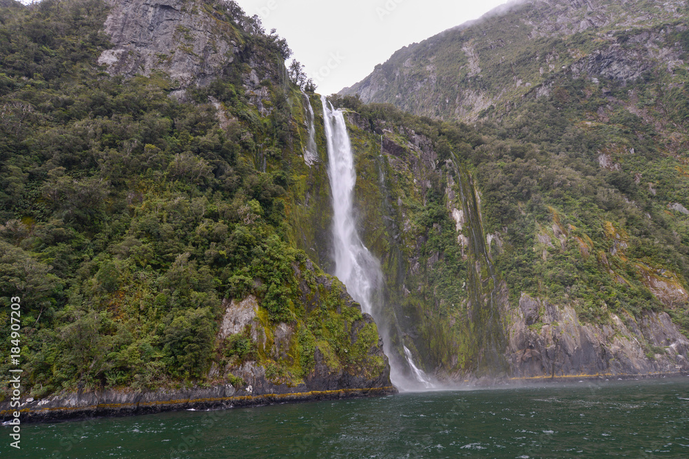Waterfall in Milford Sound New Zealand