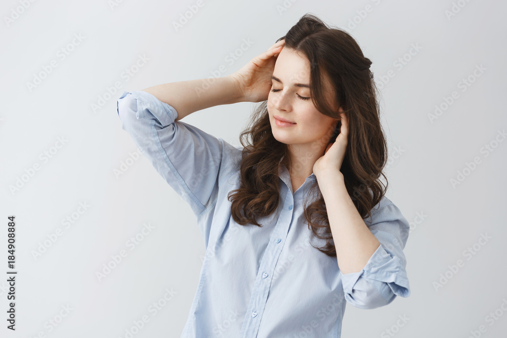 Portrait of attractive sexy girl with dark wavy hair and closed eyes,trying to wake up in early morning after two weeks of vacation. Portrait of attractive sexy girl with dark wavy hair and closed eyes,trying to wake up in early morning after two weeks of vacation.