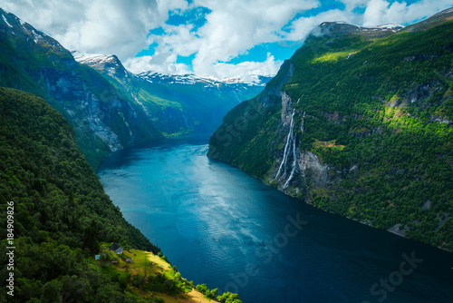 Breathtaking view of Sunnylvsfjorden fjord and famous Seven Sisters waterfalls, near Geiranger village in western Norway.