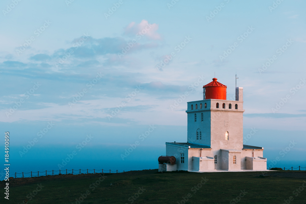 White lighthouse at Cape Dyrholaey, Iceland. Landscape photography