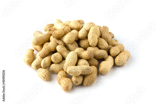 Peanuts in plastic packaging. Fresh peanuts without shell in a plastic container on a wooden table.