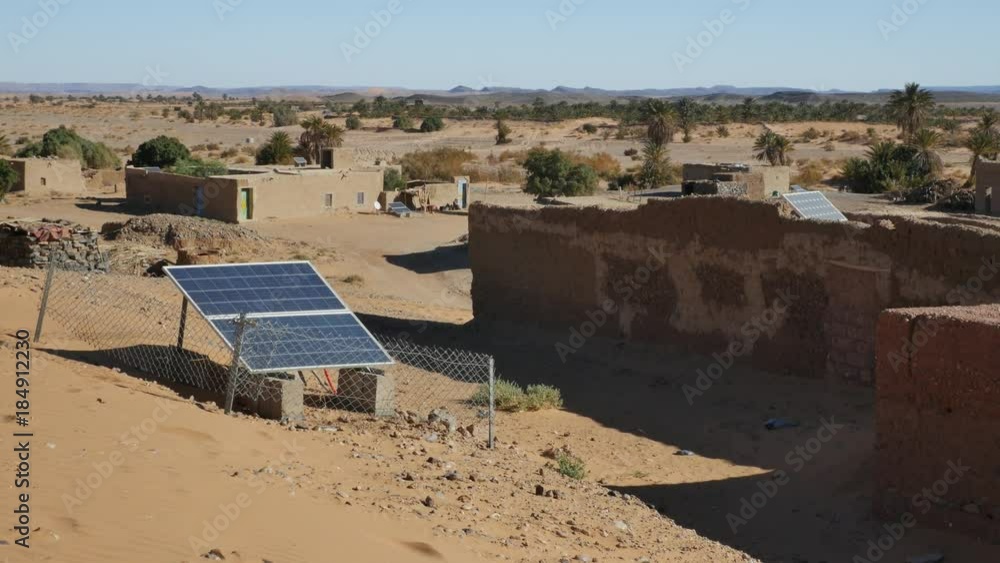 Village in the middle of the Moroccan desert in Africa with solar energy panels