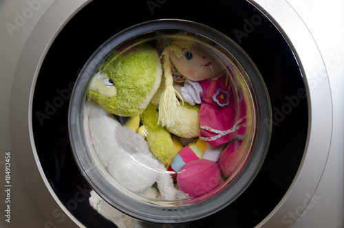 Washing machine door with rotating toys inside