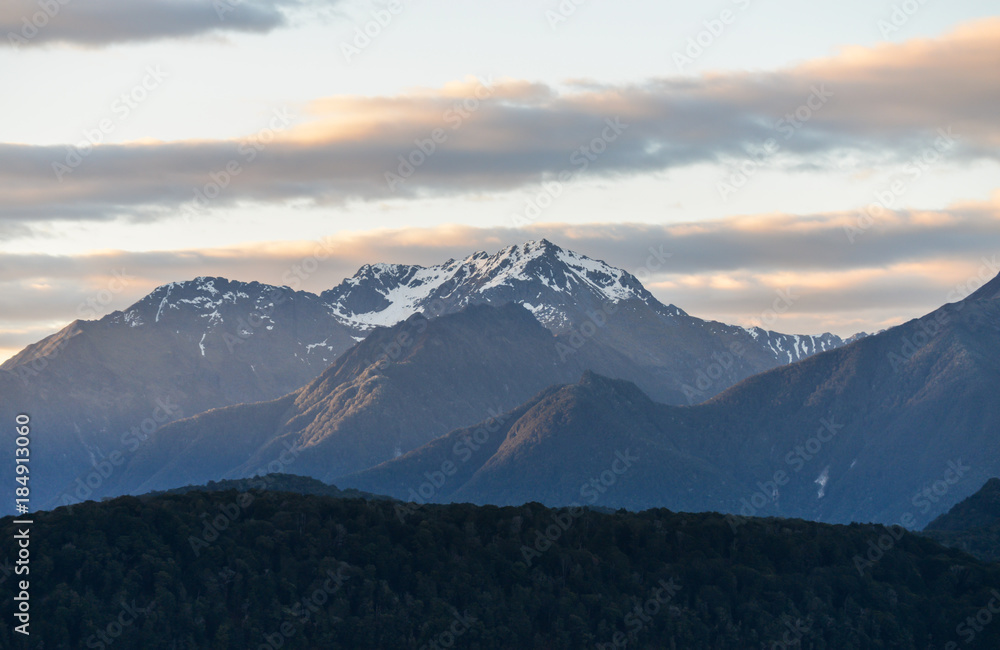 Snowy mountains with evening sun light in New Zealand