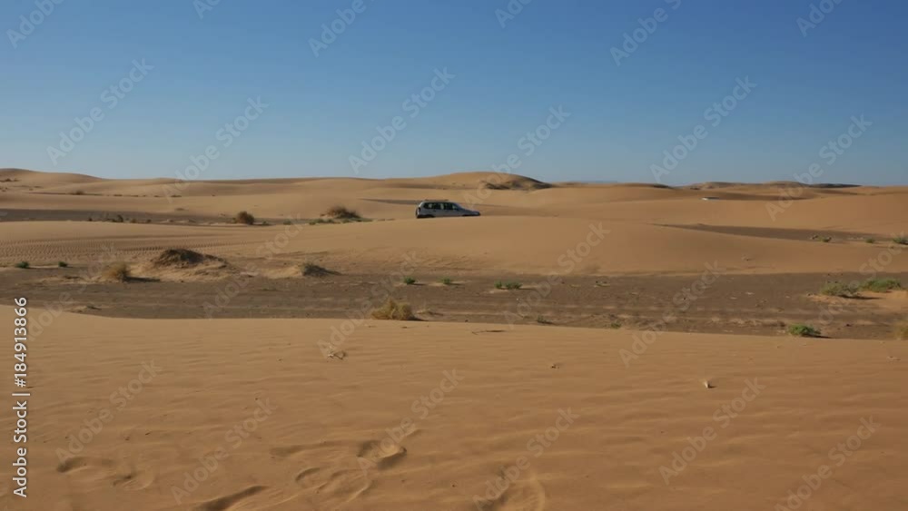 Four wheel drives in the Sahara, traditional entertainment for tourists in Moroccan desert 4K Four wheel drives in the Sahara, traditional entertainment for tourists in Moroccan desert 4K