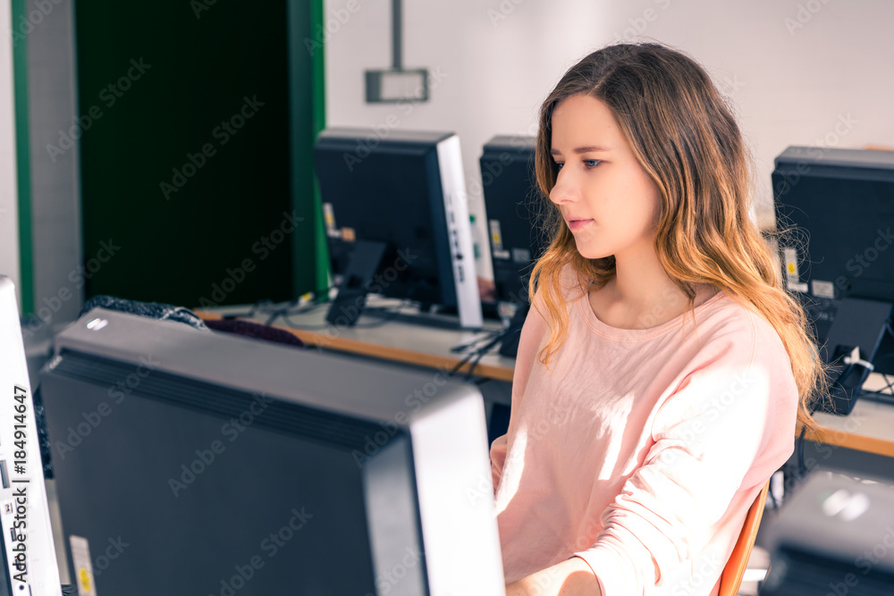 Young Student Girl Female in Bright Computer Lab University Classroom Learning Working Studying Using Young Student Girl Female in Bright Computer Lab University Classroom Learning Working Studying Using
