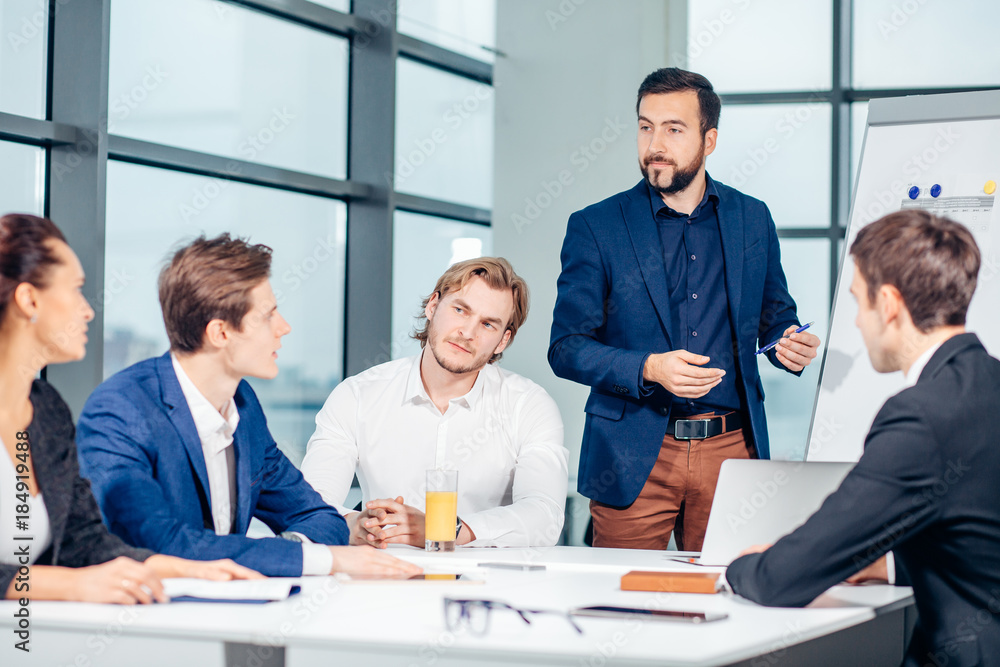 business, technology, people, deadline and team work concept - smiling male boss talking to business group at office background - obrazy, fototapety, plakaty 