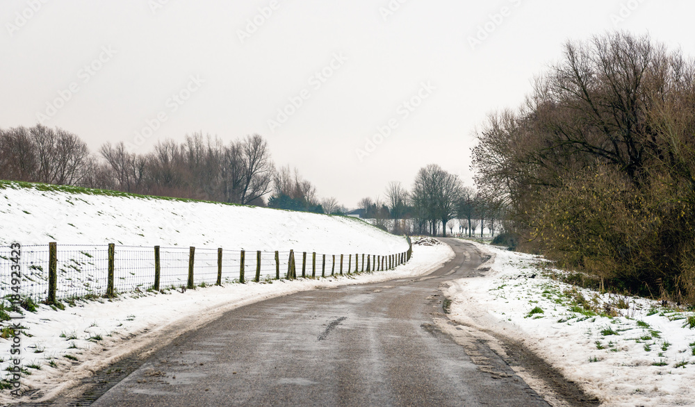 Meandering country road in wintertime Meandering country road in wintertime