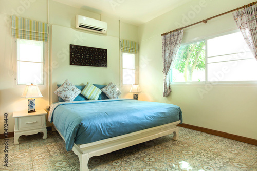 Luxury Interior design in bedroom of pool villa with cozy  bed © Stock PK