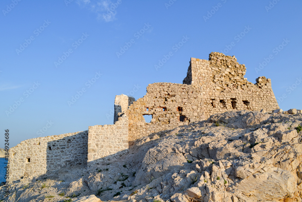 Ruins of old castle against blue sky