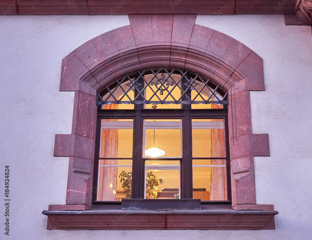 Fototapeta premium elegant house window, lights on