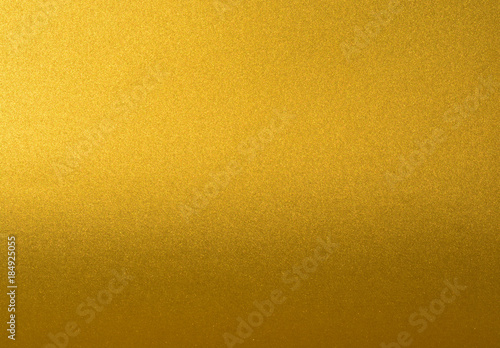 Details of golden texture background with gradient and shadow. Gold color paint wall. Luxury golden background and wallpaper. Gold foil or wrapping paper.