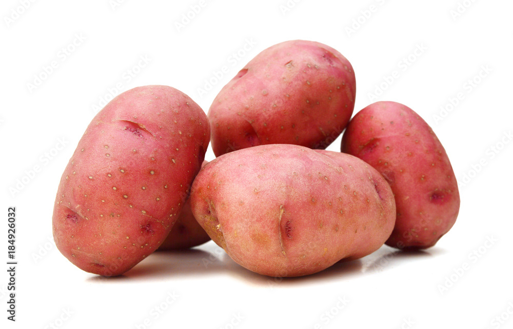Close up of two red potatoes against white background. Close up of two red potatoes against white background.