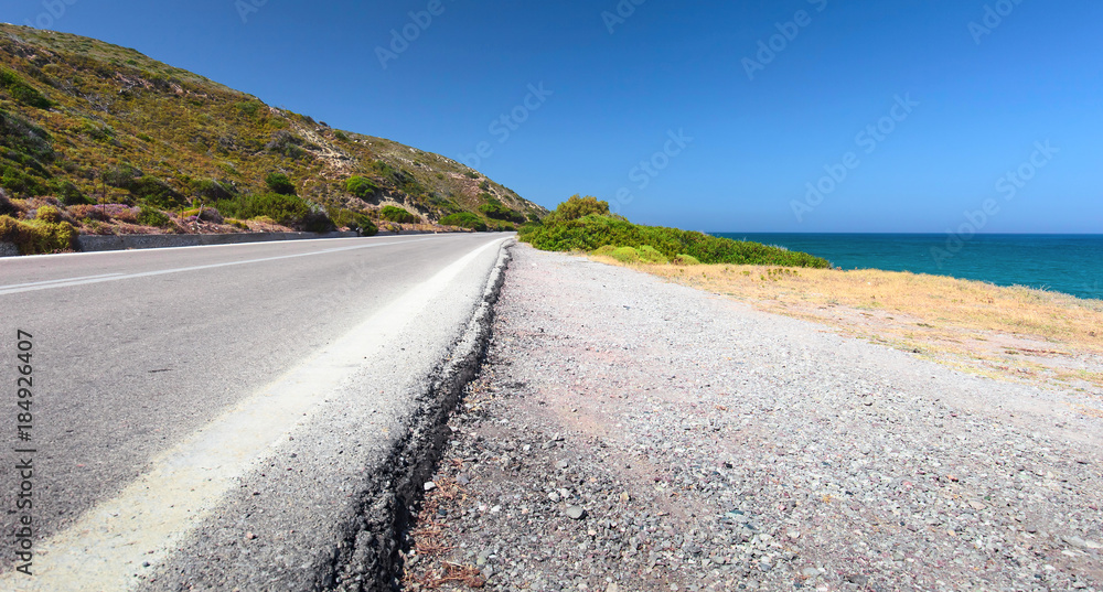 Road on a sea shore. Greece, Rhodes. Road on a sea shore. Greece, Rhodes.