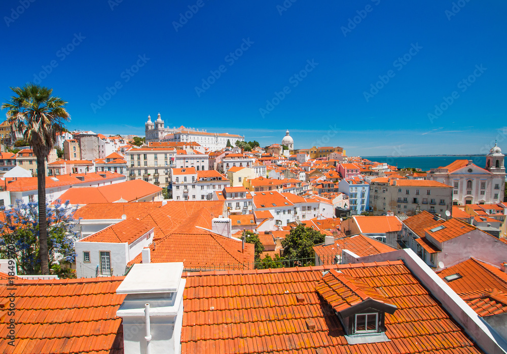 Aerial view of central Lisbon with red tile roofs and monastery Igreja Sao Vicente de Fora, Portugal 