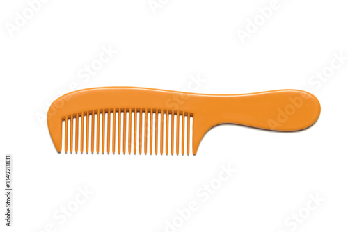 Orange comb is placed on a white background.