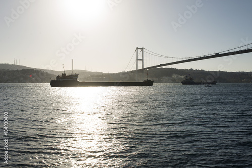 A view of bosphorus Istanbul and big ships passing by the bridge