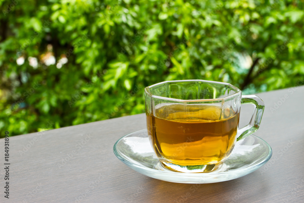 A cup of tea on the table in the garden A cup of tea on the table in the garden