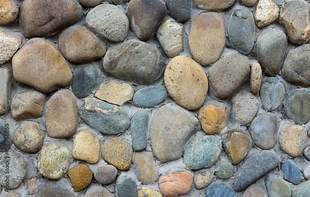 wall stone beige gray round cemented pattern close-up grunge background wall stone beige gray round cemented pattern close-up grunge background