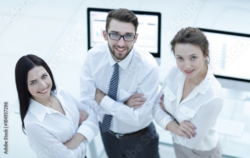 Wallpaper Mural successful business team giving each other a high five . Torontodigital.ca