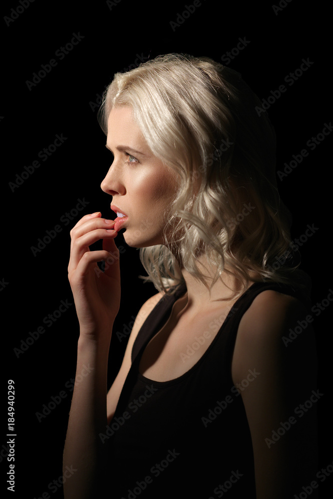 Girl with white hair and natural makeup bites her nails Girl with white hair and natural makeup bites her nails