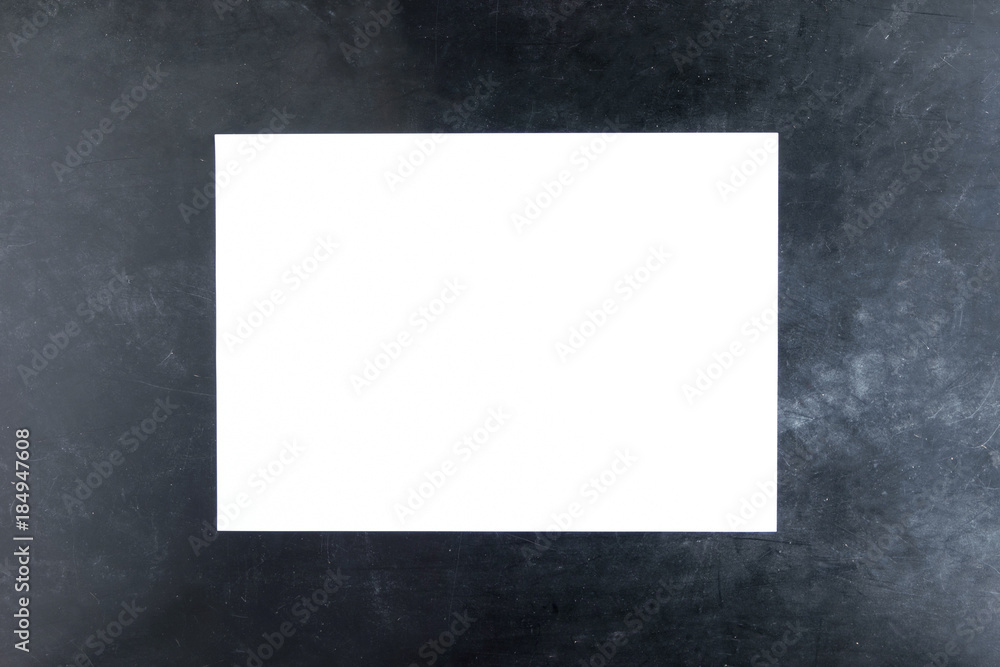 sheet of white paper on black background sheet of white paper on black background