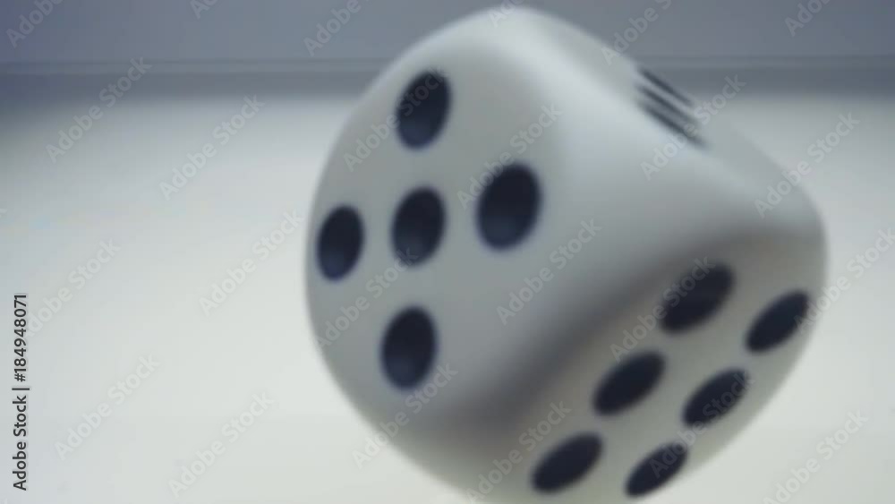 White dice falls spinning and jumps from the white glossy luminous surface and flies to the camera. Closeup. Slow mo, slo mo, slow motion, high speed camera, 240fps, 250fps
White dice falls spinning and jumps from the white glossy luminous surface and flies to the camera. Closeup. Slow mo, slo mo, slow motion, high speed camera, 240fps, 250fps