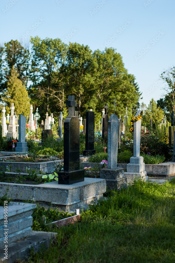 Old monuments and crosses on the classical European Catholic cemetery.