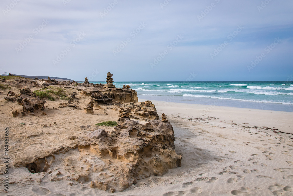 Stone cairns on the Cabo de Santa Maria shipwreck beach, Boa Esperanca or Coast of Good Hope beach Boa Vista, Cape Verde