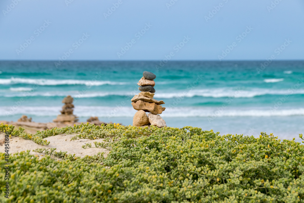 Stone cairns on the Cabo de Santa Maria shipwreck beach, Boa Esperanca or Coast of Good Hope beach Boa Vista, Cape Verde Stone cairns on the Cabo de Santa Maria shipwreck beach, Boa Esperanca or Coast of Good Hope beach Boa Vista, Cape Verde