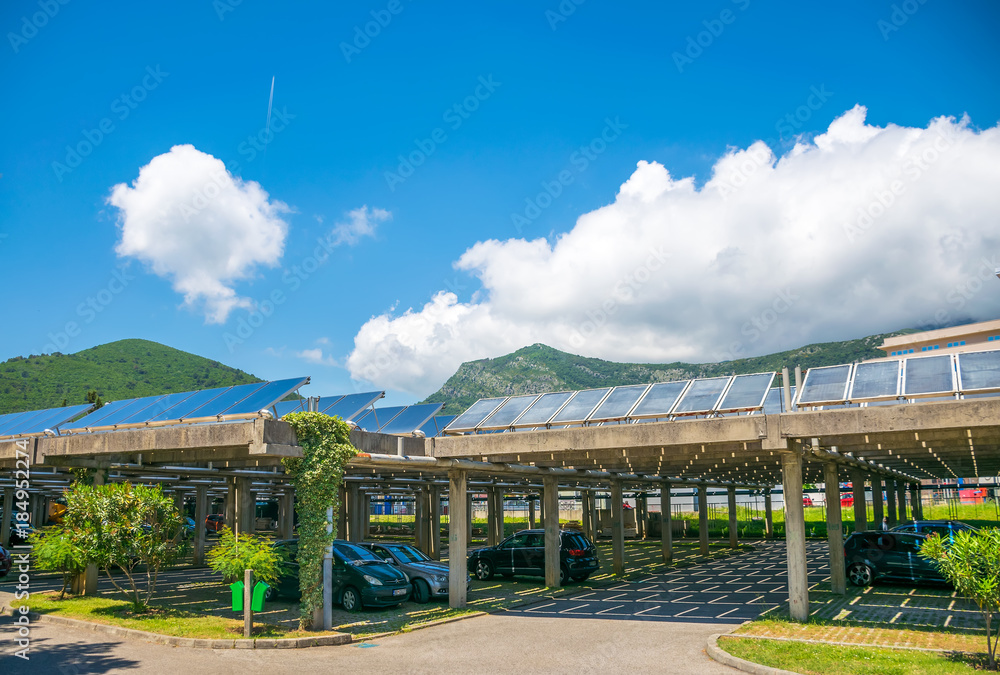 MONTENEGRO, BUDVA - May 30/2017: employees parked their cars under solar panels on the territory of the power plant.