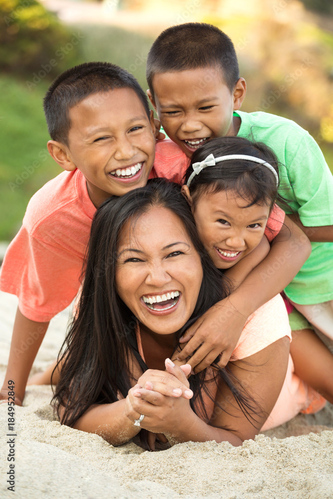 Mother and her children at the beach. Mother and her children at the beach.
