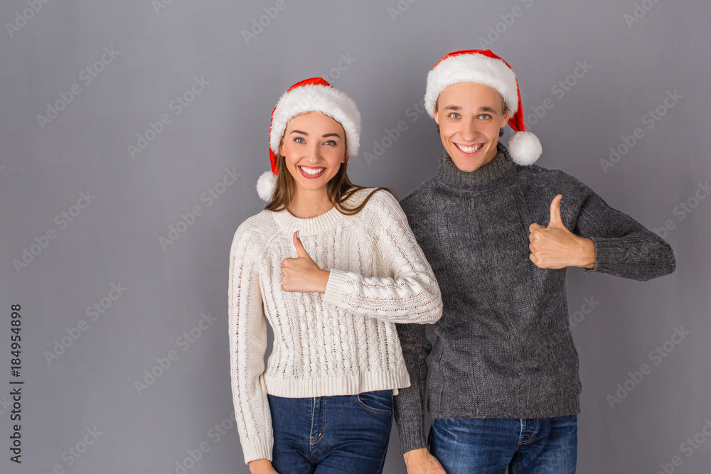 Young couple studio isolated on grey wall concept Young couple studio isolated on grey wall concept