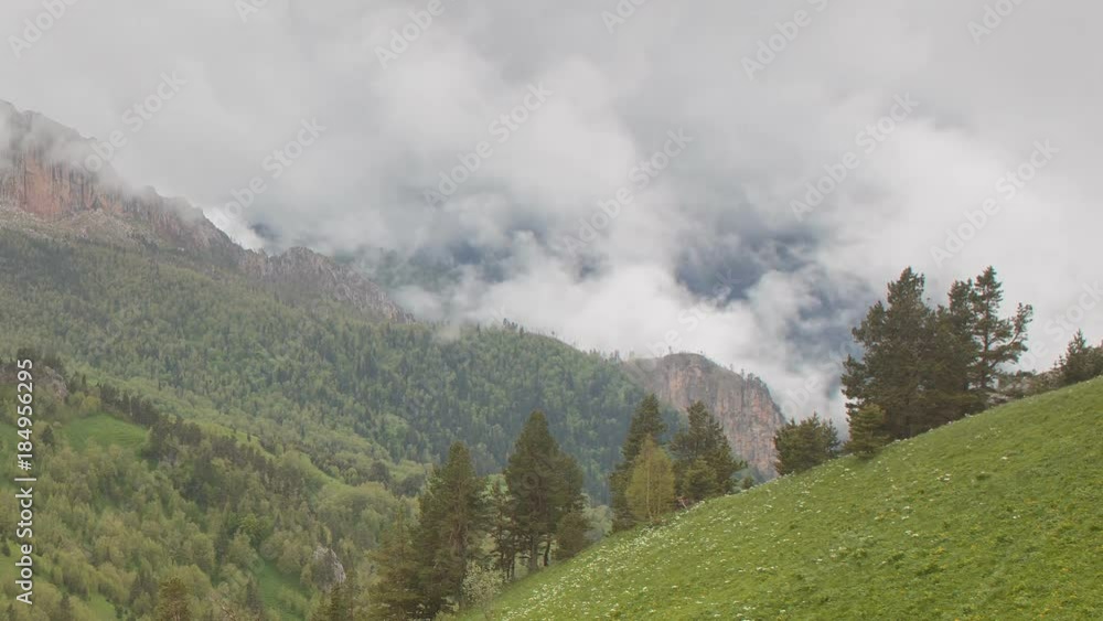 Russia, time lapse. The formation and movement of clouds over the summer slopes of Adygea Bolshoy Thach and the Caucasus Mountains Russia, time lapse. The formation and movement of clouds over the summer slopes of Adygea Bolshoy Thach and the Caucasus Mountains