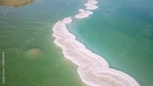 Aerial footage of the Dead Sea hotels and beaches area, flying above the salty water