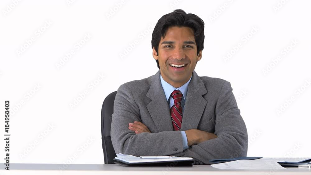 confident businessman sitting at his desk on greenscreen confident businessman sitting at his desk on greenscreen