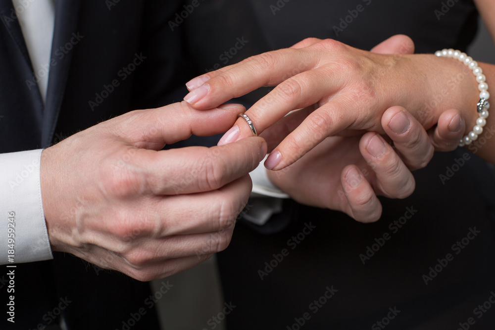 Divorce concept.A young woman removes a wedding ring from her finger.  26542717 Stock Photo at Vecteezy