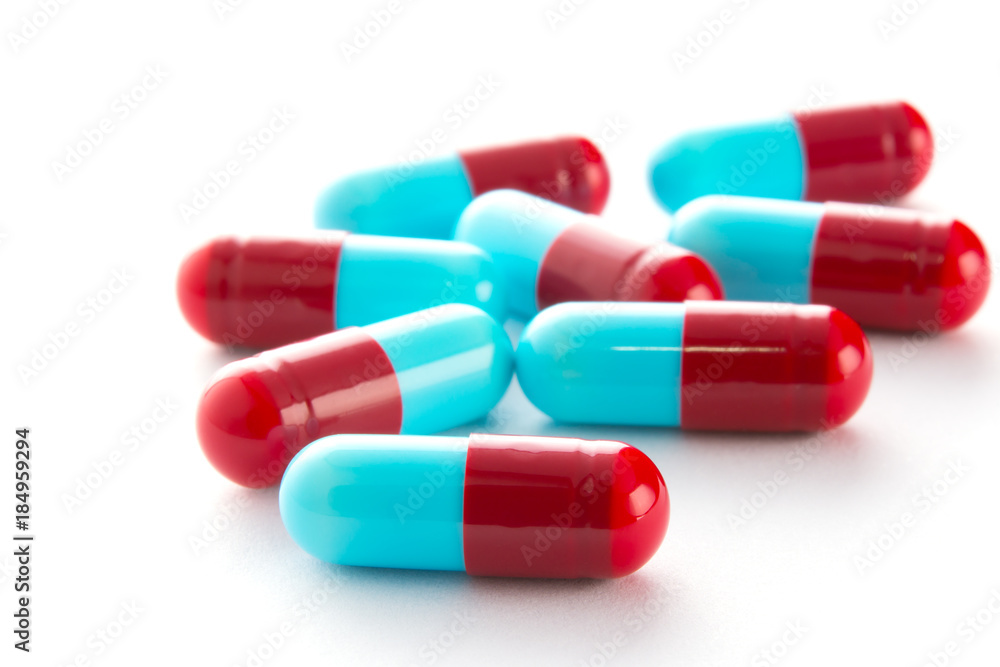 capsules of medicine on white background