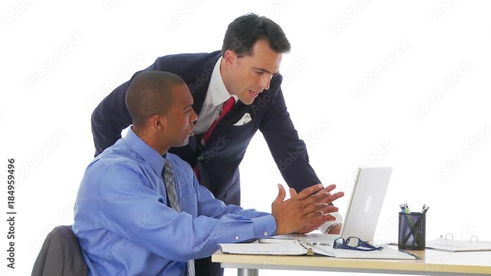 Two businessmen working on laptop Two businessmen working on laptop